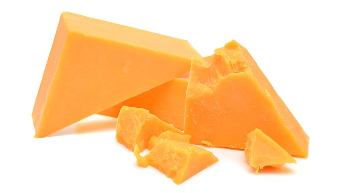Some lumps of hard orange cheese