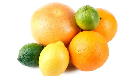 A small pile of lemons, oranges and limes