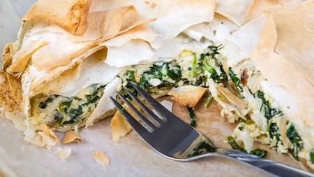 a plate of spinace and cheese filo pastry pie